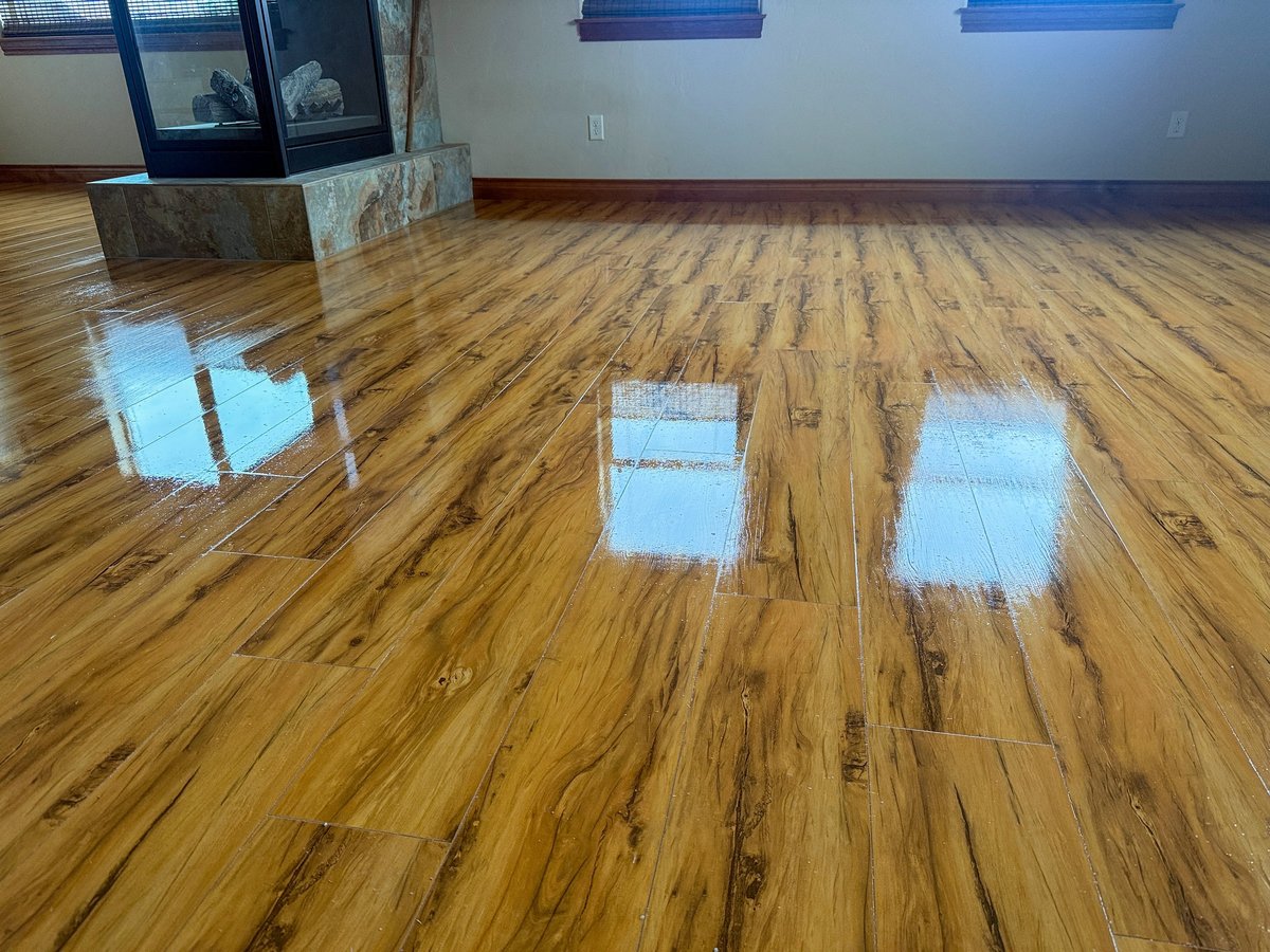 Shiny hardwood floors in a sunlit room